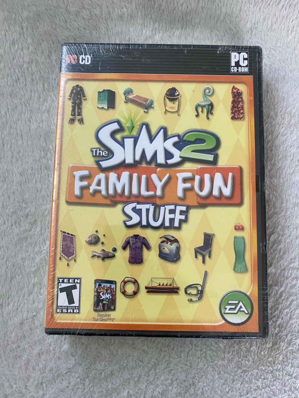 The Sims 2 Family Fun Stuff Expansion Pack - Yellow/Orange Cover